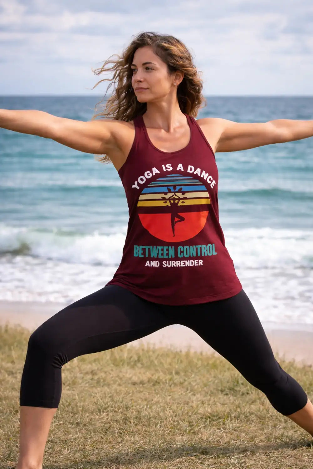 Maroon tank top with a vintage-style graphic featuring the text ’yoga is a dance between control and surrender’ and a colorful sun design.